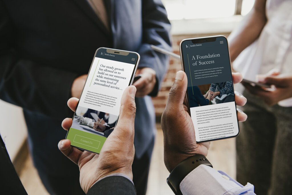 Two business men sharing a Mobile Responsive website design for a law firm