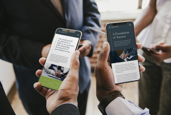Two business men sharing a Mobile Responsive website design for a law firm