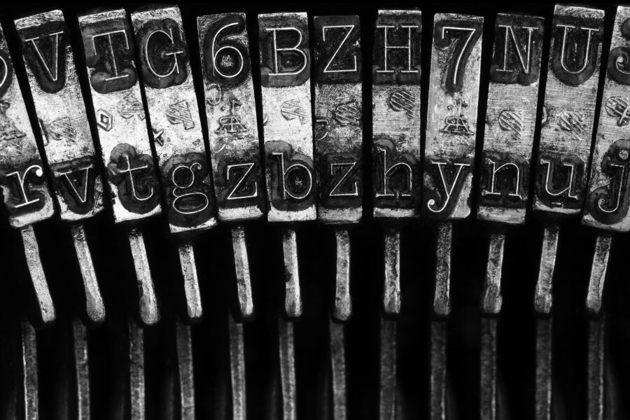 Close up photo of typewriter keys for the blog: Do you make typos, miss punctuation or make grammar mistakes? Learn how that affects your brand in this article.