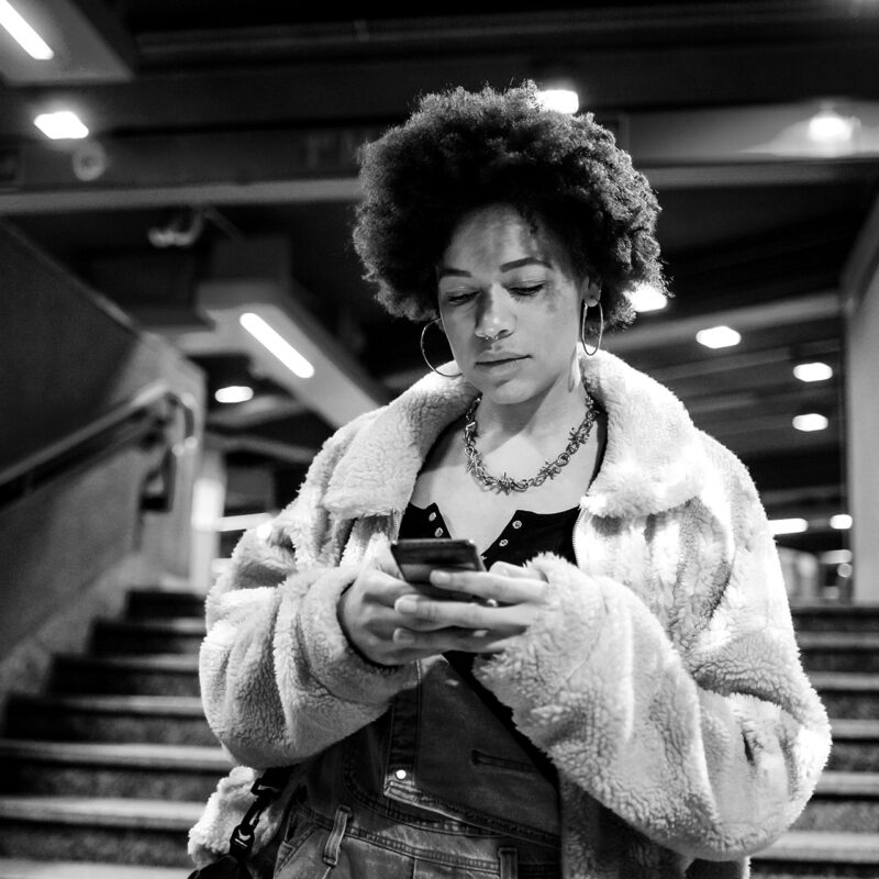 a young woman using a mobile responsive website to order things from an online store