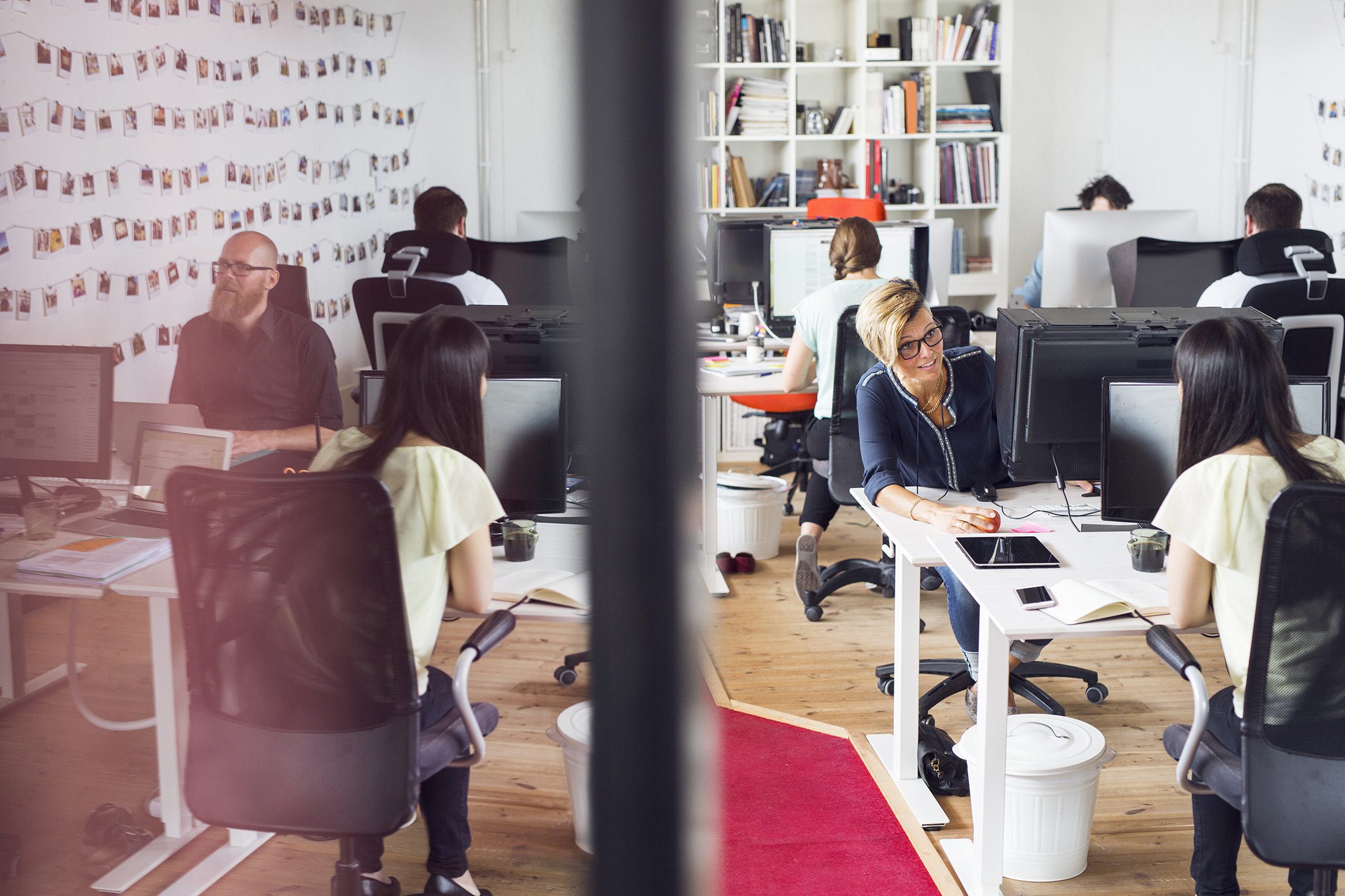 An office full of website developers, graphic designers and creative business experts.